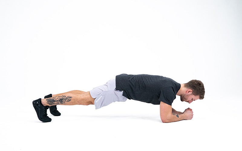 a white man doing a plank as part of his full body workout