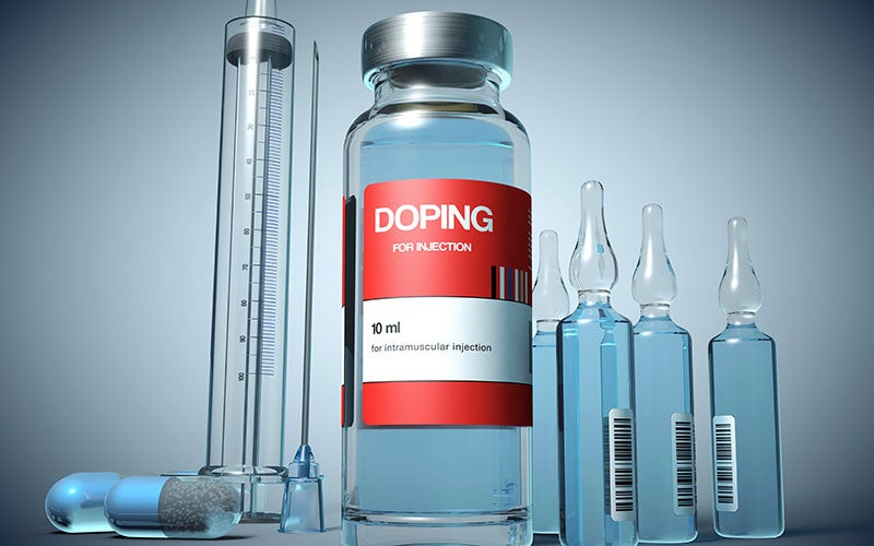 Several bottles, syringes and ampoules labeled with DOPING. 