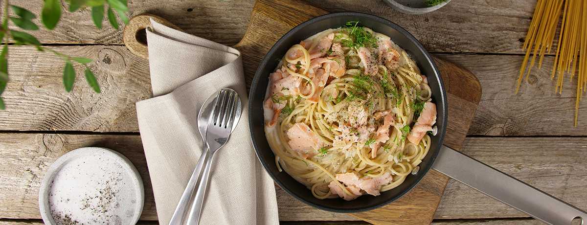Creamy salmon noodles in a bowl to help you hit IIFYM goals