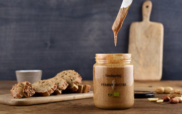 a jar of foodspring's organic Peanut Butter