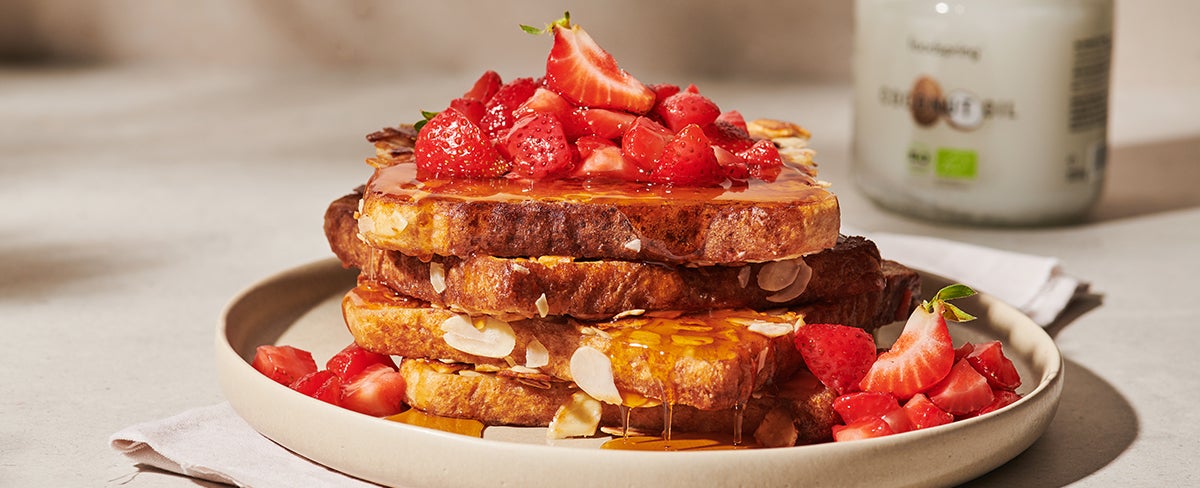 A plate of almond French toast with strawberries