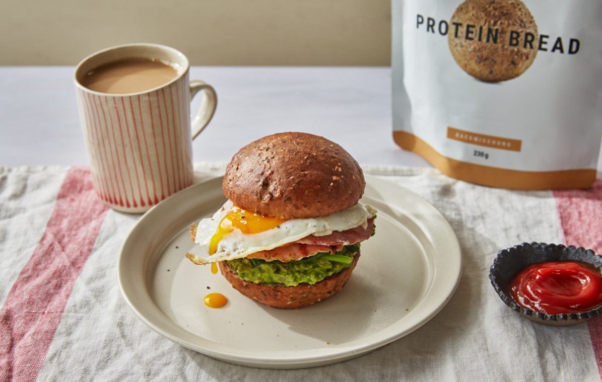 a high protein breakfast sandwich with a cup of coffee
