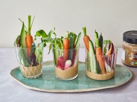 three glasses with nut butter & ginger dip and fresh vegetables