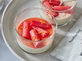Protein Panna Cotta with poached rhubarb and orange in a glass