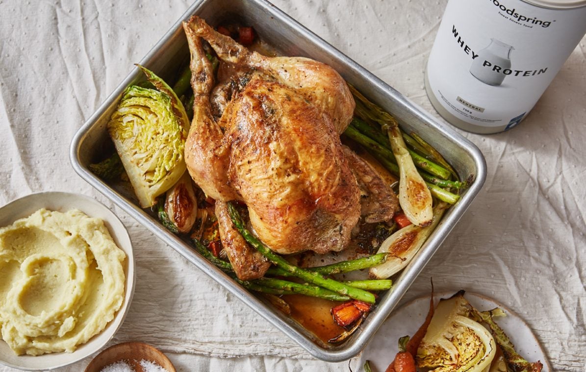 Roast Chicken with spring vegetables in a roasting dish with protein mashed potatoes