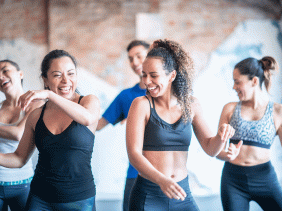Women dance and laugh