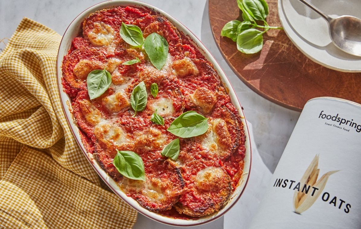 aubergine chicken parmigiana in a baking dish