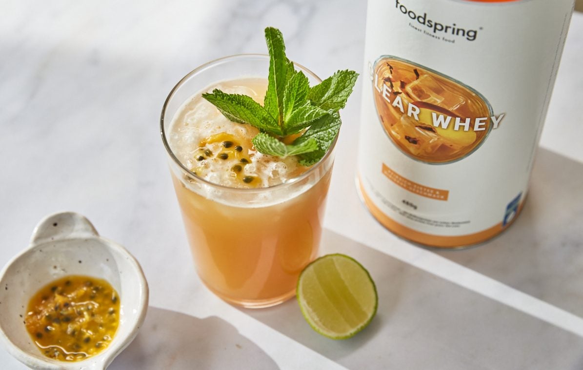 peach passionfruit cooler with sprig of mint